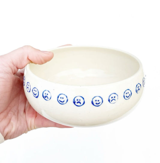 Hand-thrown cream stoneware with alternating happy sad faces in cobalt. Made in Virginia, USA by Korai Ceramics.