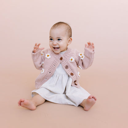 Stroll through fields of flowers with the Flower Cardigan in Blush. Featuring Cream hand-crochet flowers. Crafted with care using 100% Hand-knit Acrylic