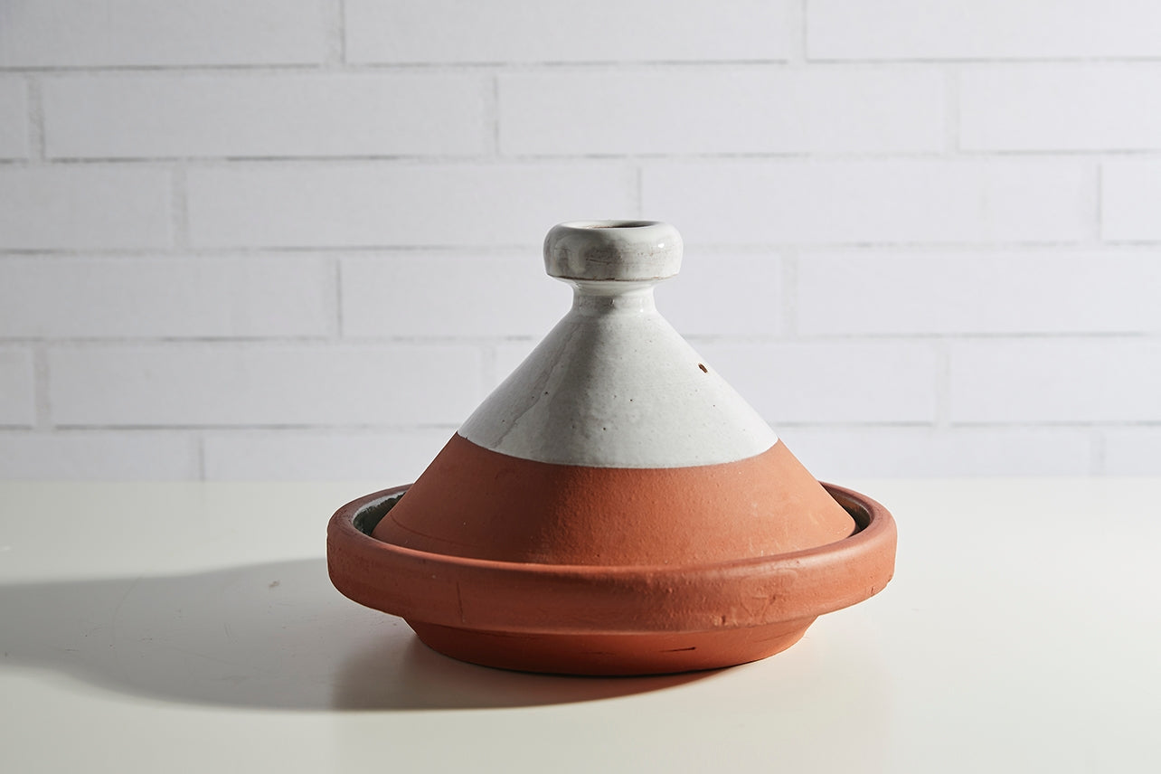 Tagines serve as both the cooking vessel and serving dish, allowing food to carmelize while cooking to stay warm for longer when serving.

Handmade out of terracotta and finished with lead-free glaze.