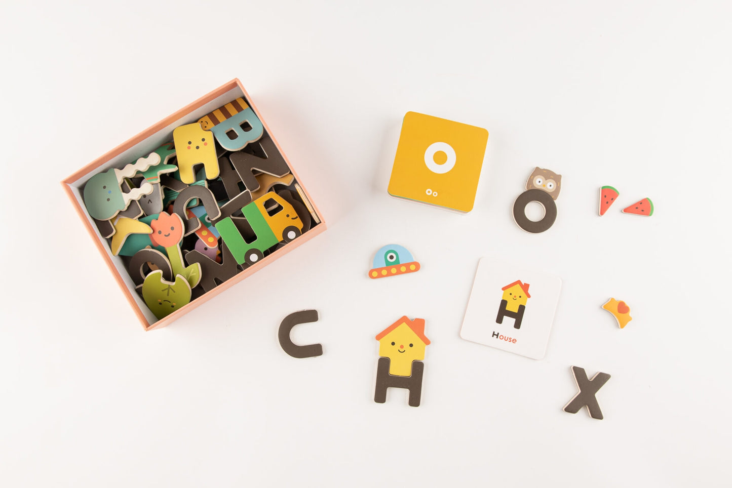 This Magnetic Alphabet Play Set is functional, durable, safe, made in the most environmentally friendly option for the material and production, and needless to say, very beautifully designed. Includes 26 magnetic pieces in capital letters with additional play shaped to match 26 cards.