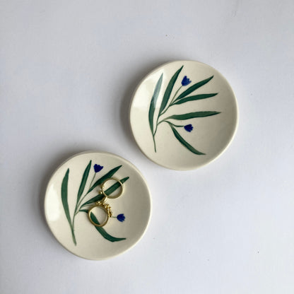 This little ceramic ring dish is made with white stoneware clay that fires warm white / beige color. Each little plate is hand painted with underglaze, all designs are free style painted and never exactly the same. Finally its glazed with clear glaze and signed underneath.
