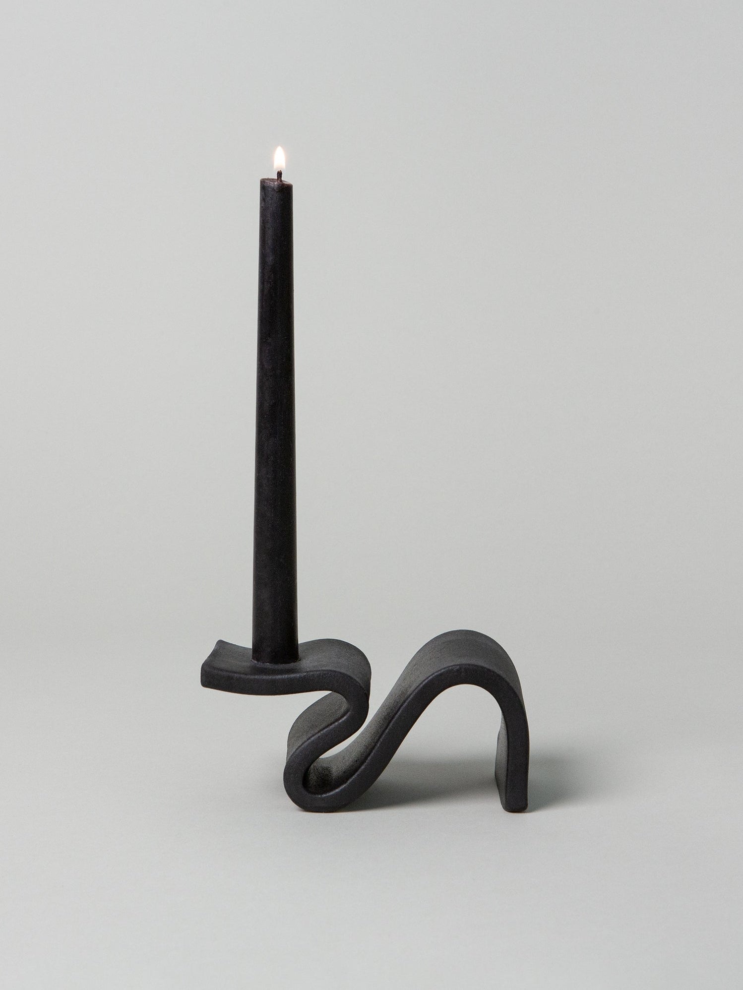 Introducing Wei, a candlestick designed to evoke the romance of a foregone era. This unique piece combines elements of classic design with a modern twist. Its cantilevered surface pays homage to contemporary architecture, seamlessly blending tradition with innovation. Handmade in Brooklyn, NY.