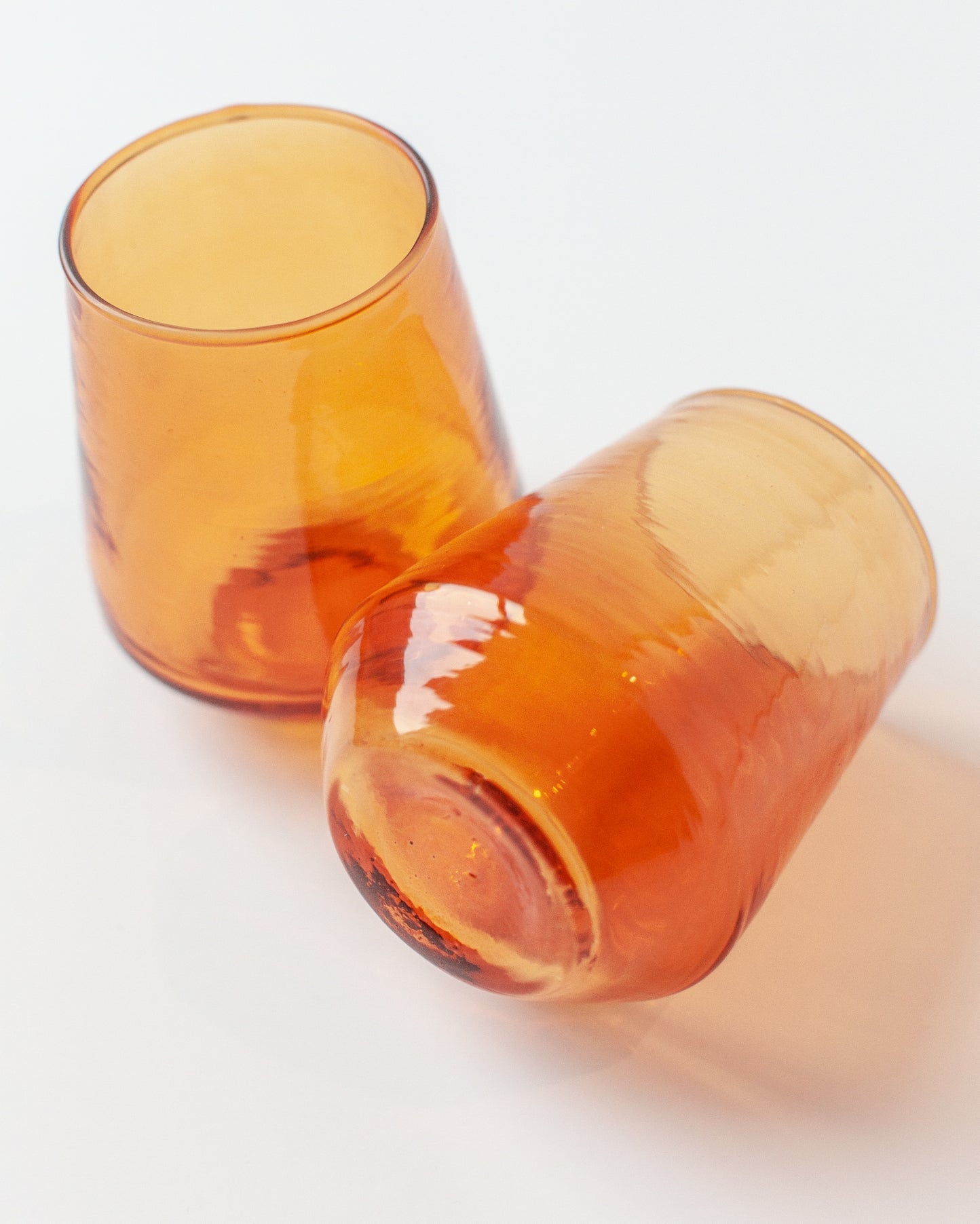 Sip in style with these handblown hammered glass tumblers. Handcrafted from 100% recycled colored glass.