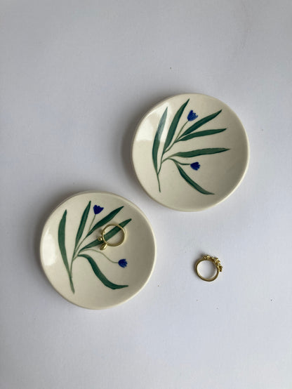 This little ceramic ring dish is made with white stoneware clay that fires warm white / beige color. Each little plate is hand painted with underglaze, all designs are free style painted and never exactly the same. Finally its glazed with clear glaze and signed underneath.
