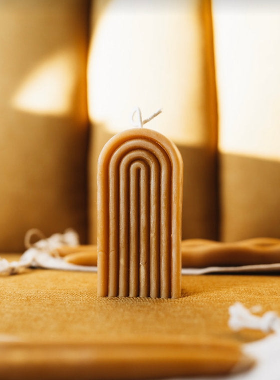 This modern pillar candle, aptly named is hand-poured with pure beeswax and given a organic cotton wick. It smells of beeswax which could be described as honey rainbows, and sunshine.