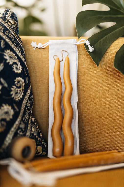 The wavy taper candles are hand-dipped and then shaped by hand and dipped again up to 30x. The unique wavy shape gives the traditional taper a modern style. Pure beeswax dipped on hemp/beeswax wick. 