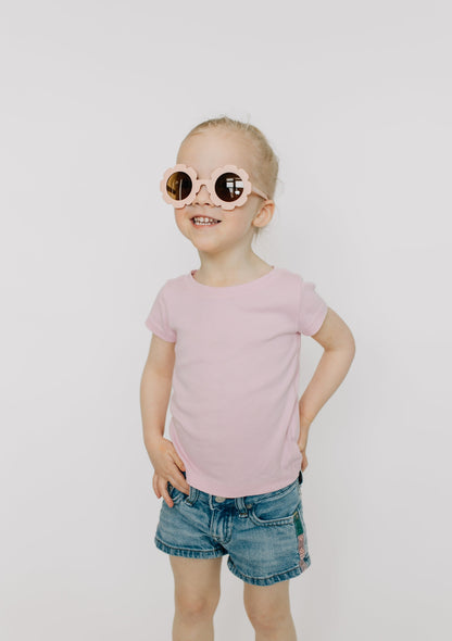 Kids sunglasses are made of recycled plastic and feature UV400 protection. They fit most toddlers and kids 12 months and up, but sizing will depend on the child's head size.