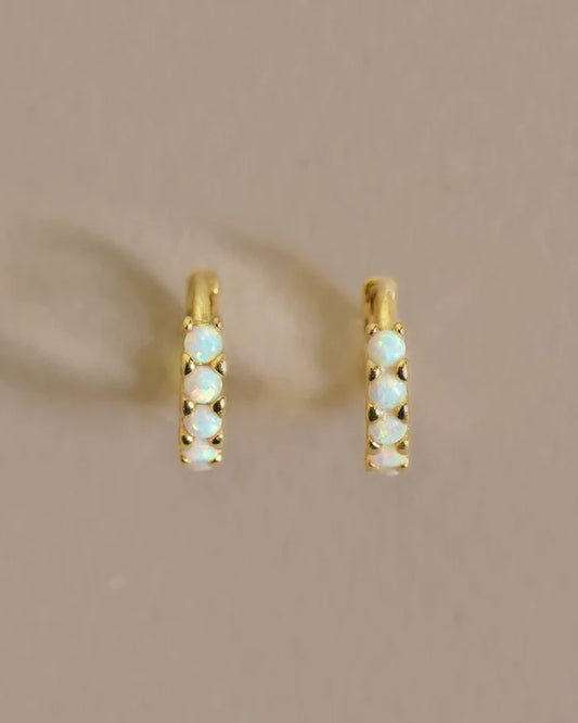 A versatile hoop with colorful Opal stones. This eye-catching everyday earring is a perfect, subtle, understated adornment for any day or occasion. Handmade in the Santa Cruz Mountains.