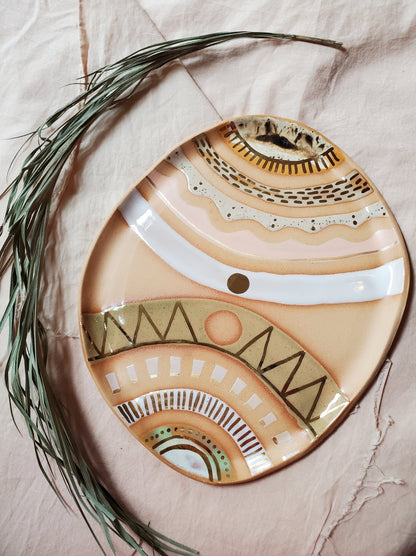 Handmade ceramic dish featuring fun designs and gold luster accents.