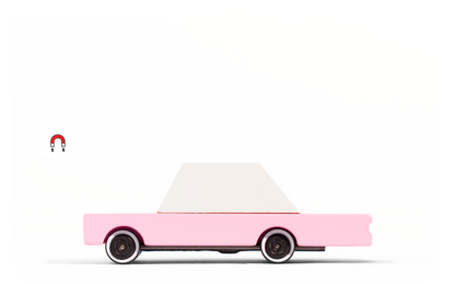 Pink Sedan toy car by Candylab Toys features solid beech wood and water-based paints. Made sustainably, made to last, made for fun. Wood, soy inks, water-based paints, degradable rubber, and metal parts are all part of Candylab's old school way of making toys, with a modern design twist.